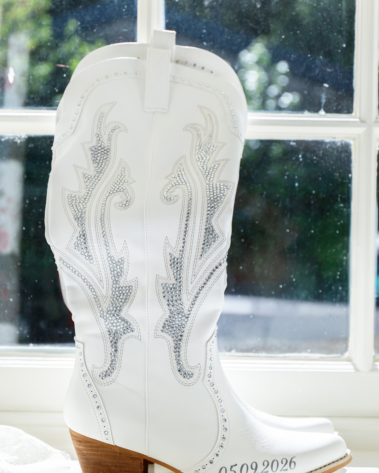 White rhinestone-embroidered wedding boot with the wedding date engraved on the sole